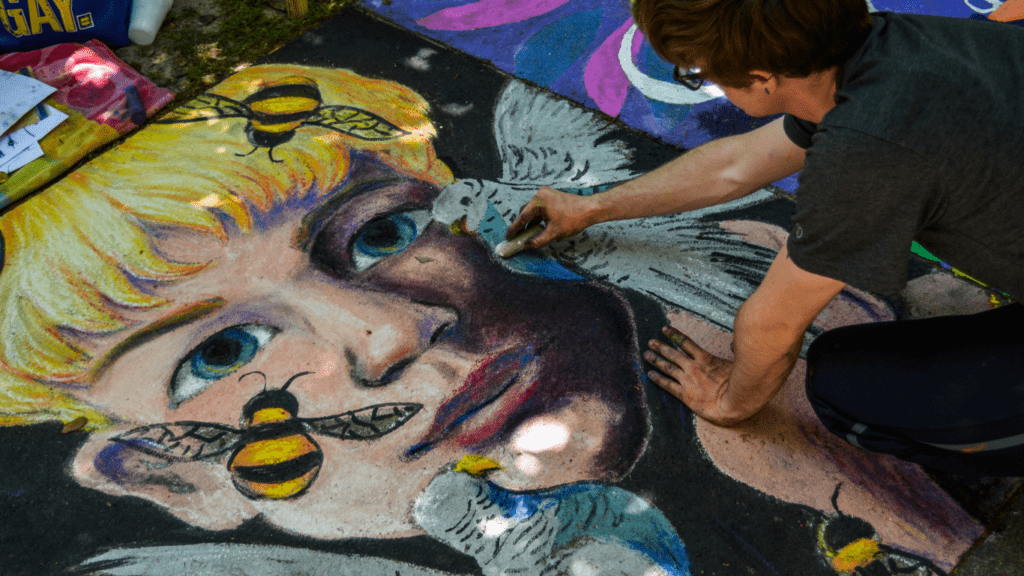 Man painting face and bird